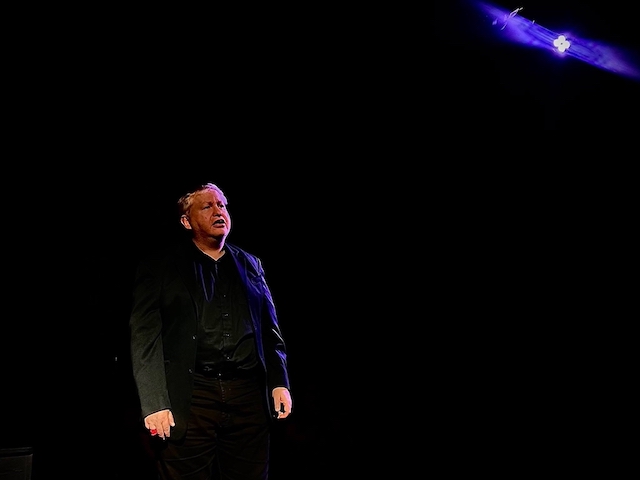 Duane performing on stage in The Laramie Project